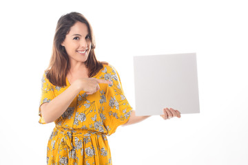 Portrait of a young woman with blank billboard isolated on white background