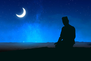 Fototapeta premium Silhouette of Muslim man in praying position (salat)