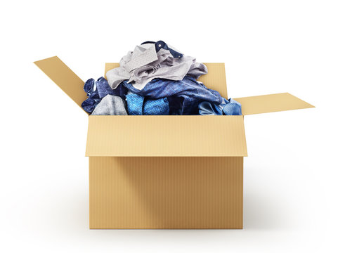 Cardboard box with clothes isolated on white background. Donation.