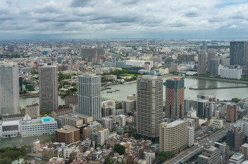 Fototapeta na wymiar Tokyo cityscape aerial drone shot with skyscrapers and river