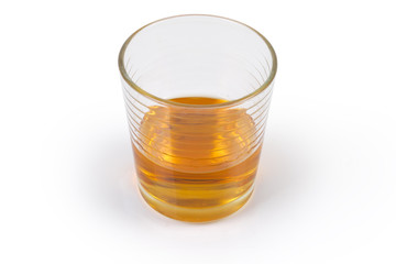 Glass of whisky on a white background