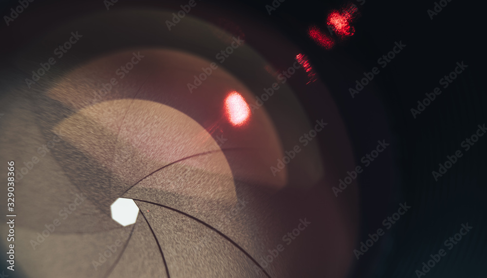 Aufkleber beautiful camera lens with orange light of glass. background pattern for design..