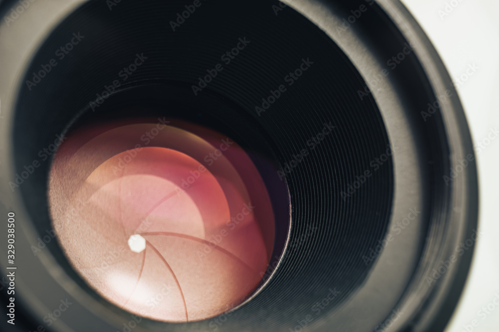 Poster beautiful camera lens with pink light of glass. background pattern for design..