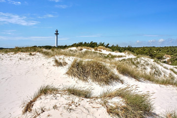 Dueodde Lighthouse (Dueodde Fyr) built in 1962 seen over sand dunes, Bornholm island, Denmark