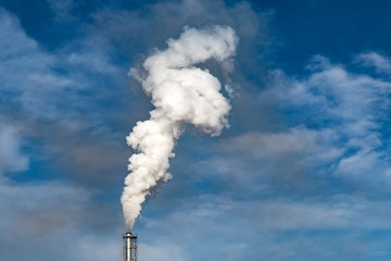 Smoke coming from the chimneys of the plant factory. Air pollution concept