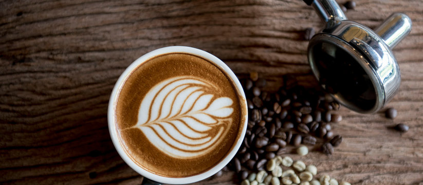 cups of cappuccino with latte art on  wooden background,top view,flat lay