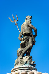 Closeup of the bronze statue of Neptune, Roman God, fountain in Piazza del Duomo (Cathedral...