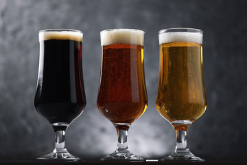 Choose from three different types of craft beer in glasses on a dark background