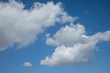 Naklejka na ściany i meble fluffy clouds and blue sky