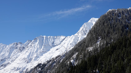 beautiful sunny day with clear blue sky in the snow capped alps in austria