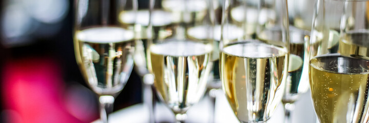 Glasses of champagne and sparkling wine served at charity event, alcoholic drinks