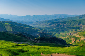 summer landscape overlooking the horizon high mountains of Armenia covered with grass