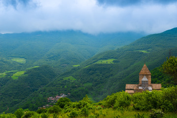 Obraz premium Tatev Orthodox Monastery and the green mountains of Armenia on a summer day