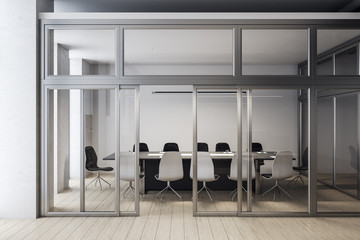 Modern meeting room interior with blank white wall.