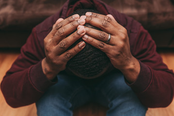 black african american man depicting a sad depressive state, depression concept
