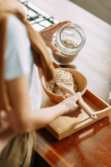 Beautiful couple preparing food. Love story in the interior Studio. Happy and laughing people. Breakfast is served in the kitchen.