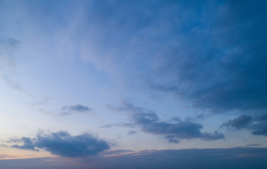 Evening blue sky with moderate clouds.