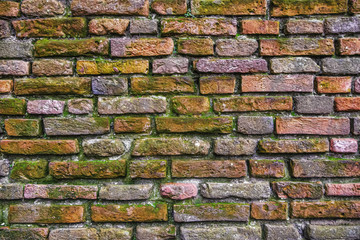 Old brick wall with weathered texture of bricks