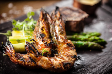 Tasting menu. Beef steak and grilled tiger prawns.