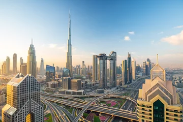 Foto op Plexiglas Uitzicht op de zonsopgang over de skyline van Dubai Downtown © Anita Gläßner
