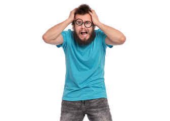 Crazy Scared or Surprised Man with funny Curly Hair in eye Glasses, looks worried. Bearded guy...