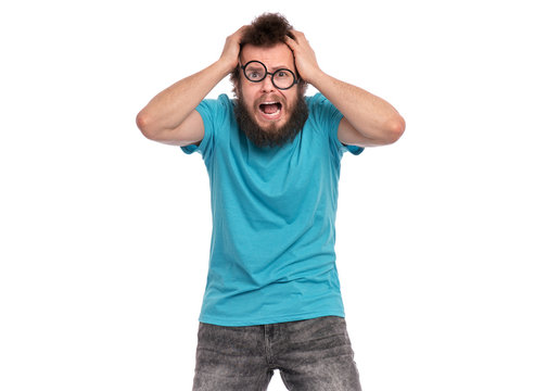 Crazy Scared or Surprised Man with funny Curly Hair in eye Glasses, looks worried. Bearded guy afraid and shocked, isolated on white background. Emotions and signs concept.