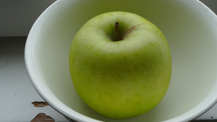 green apple on the breakfast table