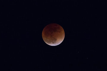 A lunar Eclipse in which the moon acquired a reddish tone