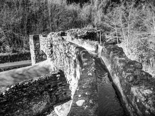 black and white photo of ruins of water mill. The Valle dei Mulini (Valley of Mills) of Gragnano, Naples, Campania, Italy