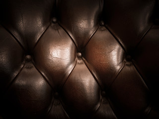 Old and dark brown padded leather texture background