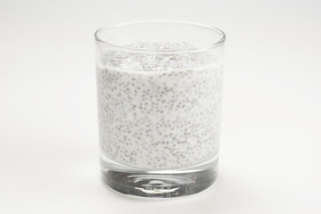 Chia pudding  in glass on a white background. Space for text or design.