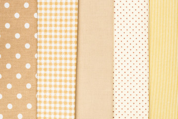 Mix of beige, white and brown cotton fabric.