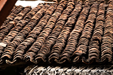 old clay roof tiles close up as background