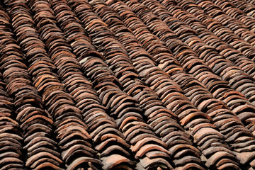 old clay roof tiles close up as background