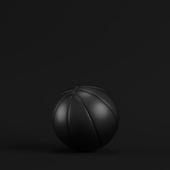 Black basketball ball on dark background. Minimalism concept.