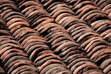 old clay roof tiles close up as background