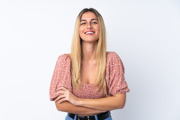 Young Uruguayan woman over isolated white background keeping the arms crossed in frontal position