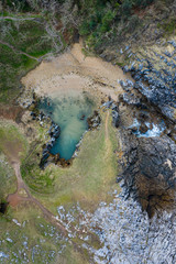 Aerial landscape of Cobijero beach and the natural arch El Salto del Caballo, Buelna, Llanes council, Asturias, Cantabrian Sea, Spain, Europe