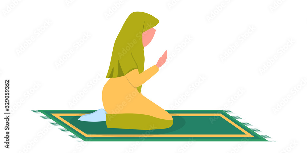 Wall mural Muslim woman praying position. Woman in traditinal clothes