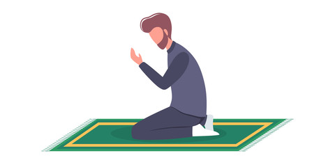 Muslim man praying position. Man in traditinal clothes