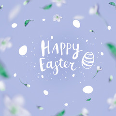 Fototapeta na wymiar Lettering Happy Easter in a frame from flowers of an apple tree, pastel blue background. Minimal Easter, spring concept