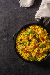 Fried rice with chicken and vegetables on frying iron pan. 