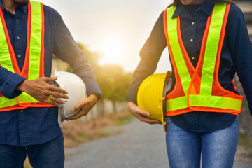 Foreman Supervisor two people holding hard hat construction