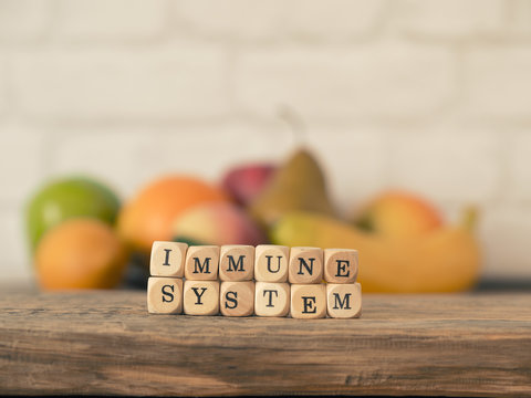 The words immune system on small wooden blocks, healthy eating concept