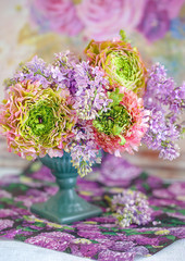 Beautiful bouquet of spring flowers in a vase on the table. Lovely bunch of flowers .