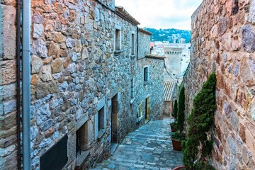 Tossa de Mar, Spain, August 2018. Narrow old street in the city fortress.