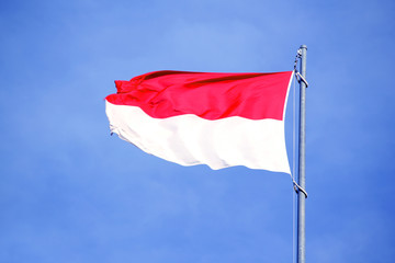 silk national flag of the modern state of Monaco, Nuremberg, Indonesia with beautiful folds waving in the wind, concept of tourism, travel, emigration, global business