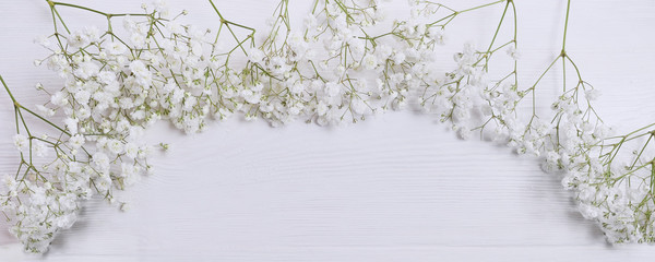 Mock up composition of white flowers gypsophila rustic style, for St. Valentine's Day with a place for your text. Flat lay, top view photo. Panoramic banner