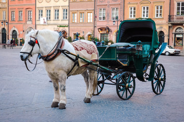 Fototapeta na wymiar Horse drawn carriage on the Old Town of Warsaw city, Poland