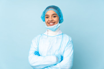 Young surgeon Indian woman in blue uniform keeping the arms crossed in frontal position